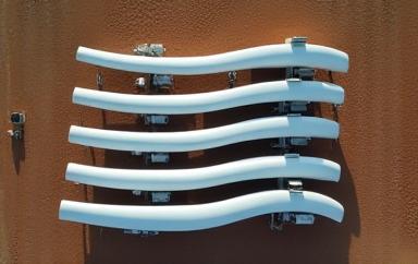 Aerial drone view of energy project site with delivered turbine blades